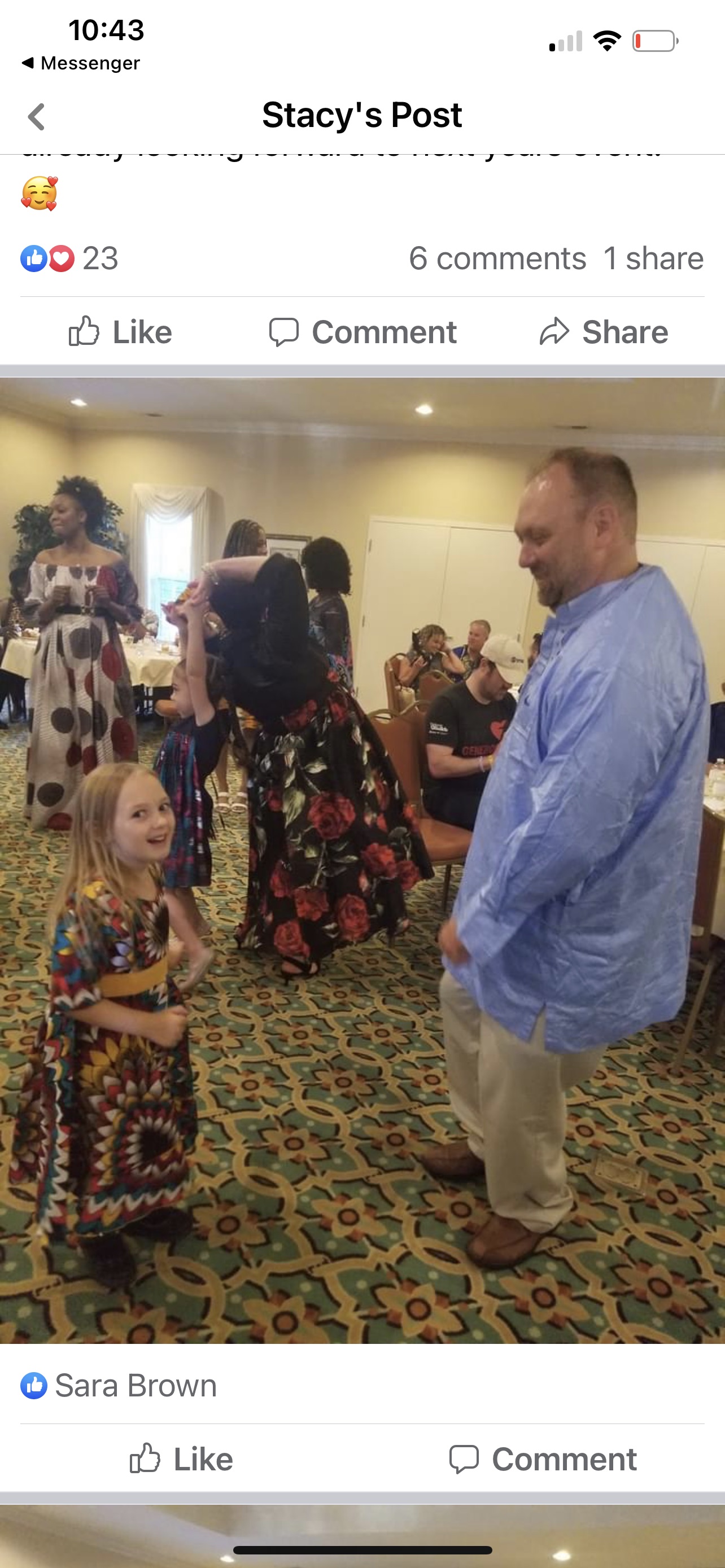 Child dancing with adult at gala
