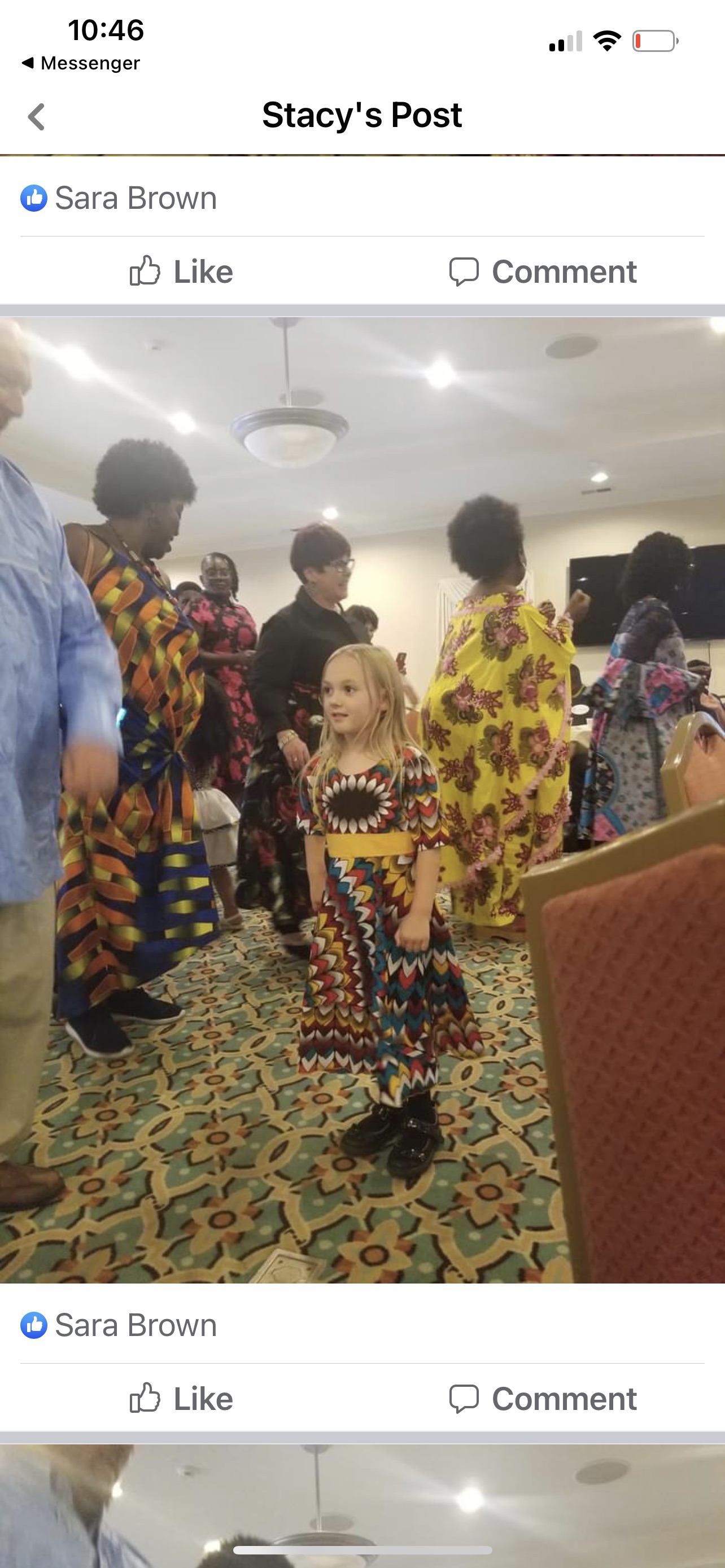 Girl in African dress among crowd
