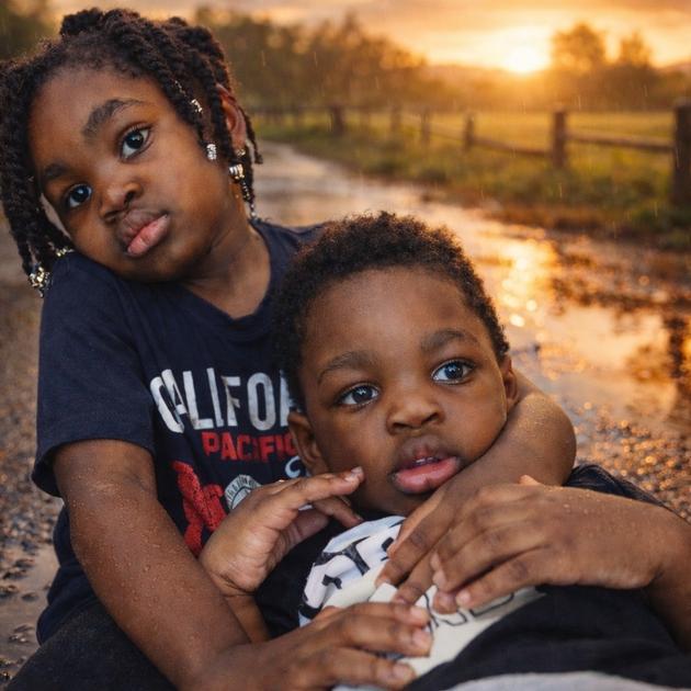 Siblings portrait at sunset